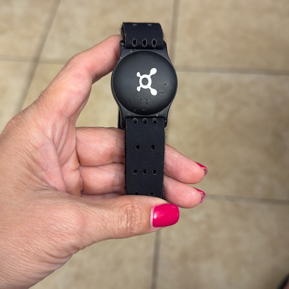 Orange Theory Fitness arm band, heart rate monitor.